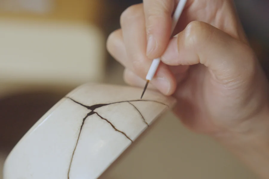 Painting Kintsugi on a bowl